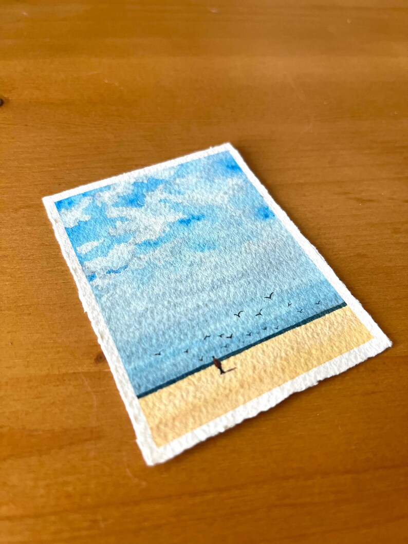 original mini watercolor painting about a lonely man on the beach