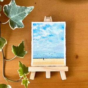 original mini watercolor painting about a lonely man on the beach