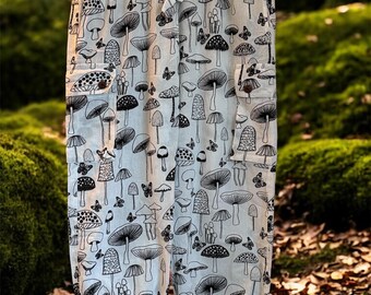 Pantalones estilo festival con estampado de setas en blanco y negro: pantalones harem bohemios de algodón lavado a la piedra.