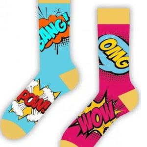May include: A pair of colorful socks with a comic book theme. One sock is blue with yellow, orange, and red text that says "BANG!" and "POW!" The other sock is pink with yellow, blue, and red text that says "OMG!" and "WOW!"