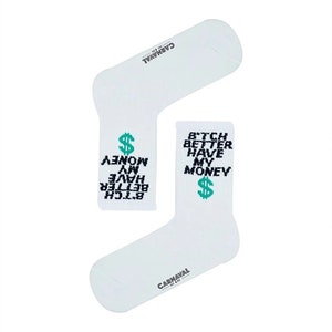 May include: Two white socks with the text "B*tch Better Have My Money" and a green dollar sign. The brand name "CARNAVAL" is printed on the socks. The socks are displayed on a white background.