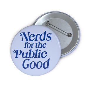 May include: A blue and white button with the text "Nerds for the Public Good" in a retro font.