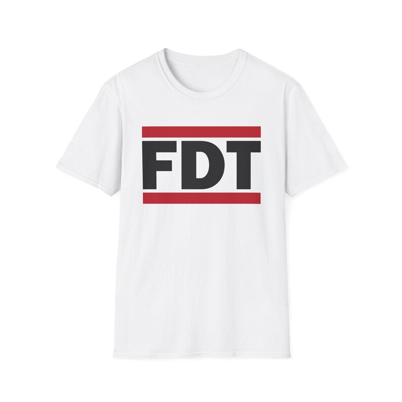 FDT shirt. This is a white tshirt with black text with the letters FDT. There are two red bars one below and one above the text. It is similar to the RUN DMC logo shirts but different enough to be distinct. The FDT on the shirt stands for Fuck Donald Trump or F Donald Trump. It is an anti Trump shirt.