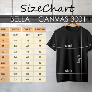 May include: Black t-shirt hanging on a wooden hanger, with a size chart for BELLA + CANVAS 3001 shirts. The chart shows measurements for width, chest, and length in inches, ranging from XS to 5XL.