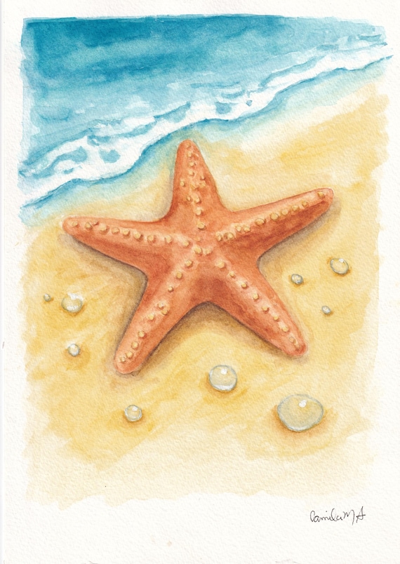 A watercolor painting of an orange starfish resting on a sandy beach near the edge of the blue ocean water. The starfish has a textured surface with small bumps. The sand is light yellow with several small, clear water droplets.
