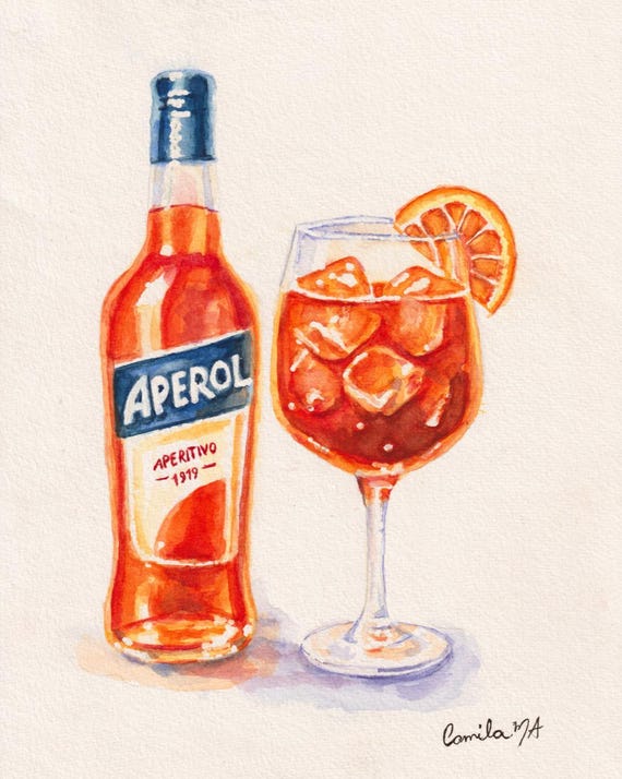 A watercolor painting of an Aperol bottle with a blue cap and a label reading APEROL APERITIVO 1919, next to a stemmed glass filled with an orange liquid, ice cubes, and an orange slice garnish. The artist signature Camila MA is visible.
