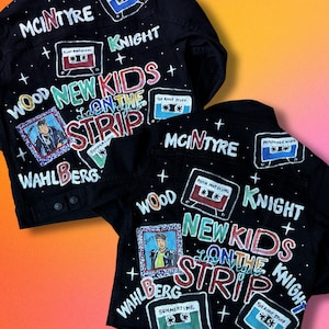 May include: Two black denim jackets featuring hand-painted designs including cassette tapes labeled "Remember When," "Please Don't Go Girl," "The Right Stuff," and "Summertime." The text "New Kids on the Strip" is painted in large, colorful letters.