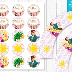 May include: Printable cupcake wrappers and toppers featuring characters from the Disney movie Tangled. The wrappers are pink with a white damask pattern and feature a sun design. The toppers feature Rapunzel, Flynn Rider, a chameleon, and the sun.