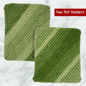 May include: Two green and white crocheted pot holders with a diagonal pattern.  "Two Pot Holders" is written in red text above the pot holders.