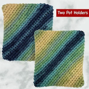 May include: Two crocheted pot holders in a blue, green, and yellow ombre pattern. "Two Pot Holders" is written in red text above the pot holders.