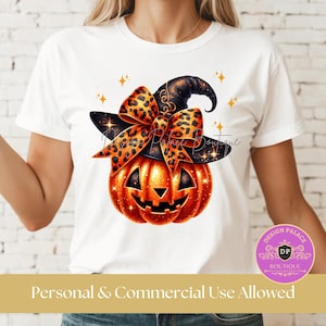 May include: White t-shirt featuring a Halloween design. The design includes a smiling orange pumpkin wearing a black witch hat and a leopard print bow. The text "Personal & Commercial Use Allowed" is at the bottom.