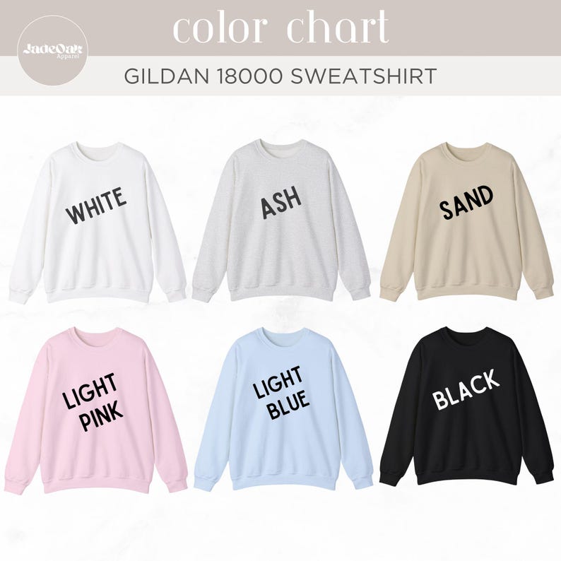 May include: A color chart of Gildan 18000 sweatshirts in various colors, including white, ash, sand, light pink, light blue, and black. Each sweatshirt has the color name printed on it in a bold, sans-serif font.
