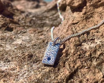 Hammer beaten blue sapphire pendant