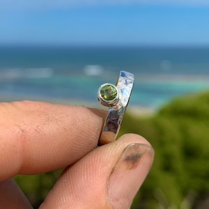 Hammer beaten, off centre bezel set wattle green sapphire ring