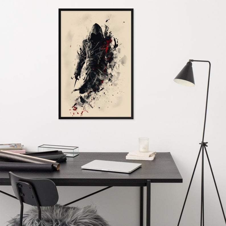 May include: Framed art print featuring a stylized figure in a hooded cloak, rendered in black and red against a beige background. The artwork has a dynamic, painterly style with splatters and drips.