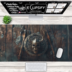 May include: A wooden desk mat with a Viking helmet and skull design. Two axes are crossed behind the shield. The desk mat is brown and has a distressed wood look.