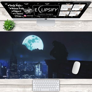 May include: A black and blue mouse pad with a cityscape and a large moon in the background. A shadowy figure sits on a rooftop in the foreground. The text "ECLIPSIFY Custom Designs" is visible in the top center of the image.