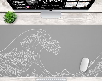 May include: A gray desk mat featuring a white outline of a Japanese wave design. A white keyboard and mouse are on the mat. The image also shows a computer monitor with the text "ECLIPSIFY Custom Designs".