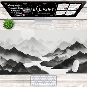 May include: Black and white desk mat featuring a minimalist mountain range landscape with a lake and fog. The design is called "ECLIPSIFY Custom Designs".