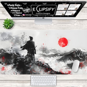 May include: Black and white illustration of a samurai standing on a mountaintop with a red sun in the background. The illustration is on a white background with red splatters of paint.