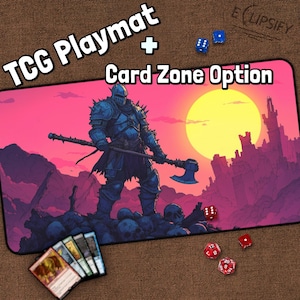 May include: A TCG playmat with a card zone option, featuring a warrior with an axe against a sunset backdrop. The playmat includes dice and a deck of cards. The text "TCG Playmat + Card Zone Option" is displayed at the top.