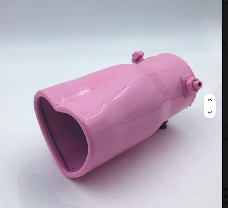 May include: A pink exhaust tip with a heart-shaped opening. The metal tip has a glossy finish and features a cylindrical body with a heart-shaped outlet. It has a bolt and a small nozzle on the side.