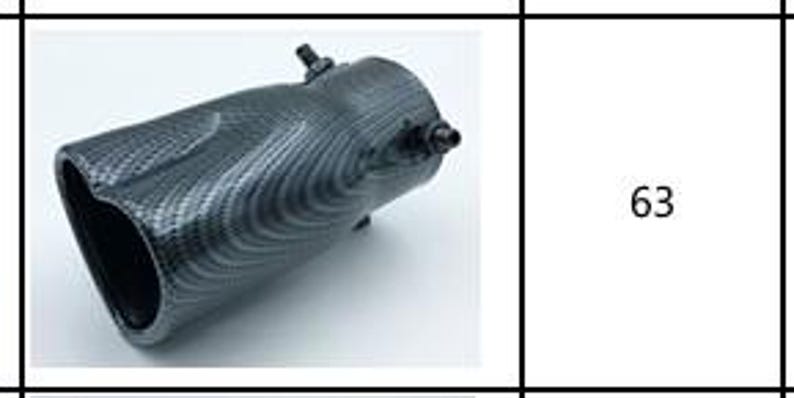 May include: A carbon fiber exhaust tip with a glossy finish. The tip has a curved design and features a visible carbon fiber weave pattern. Two small bolts are visible on the side. The number 63 is in a white box.