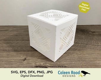May include: A white, cube-shaped paper box with geometric cut-out designs. The box is sitting on a wooden surface. The image includes the text "Digital Download File!" and "SVG, EPS, DFX, PNG, JPG Digital Download Coleen Rood DESIGNS."