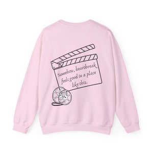 Somehow Heartbreak Feels Good in a Place like this Unisex Crewneck Sweatshirt; Movie Theater Anthem Sweater