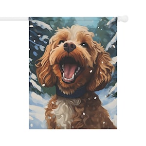 May include: A brown and white dog with a blue collar is standing in the snow. The dog has its mouth open and is looking up. There are snowflakes falling around the dog.
