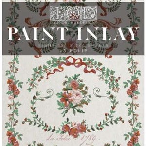 May include: Iron Orchid Designs paint inlay sheets titled La Folie featuring a floral pattern with red and pink roses, green leaves, and scrolling vines on a light background. The text reads IOD Iron Orchid Designs Paint Inlay Eight 12 x 16 Sheets La Folie 1789.