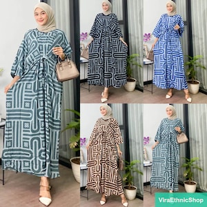 May include: Five different patterned maxi dresses with long sleeves and a tie at the waist. The dresses are in shades of blue, brown, and green.