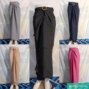 May include: Five long skirts with a decorative gold buckle on the waistband. The skirts are in various colors including gray, black, navy blue, beige, and pink.