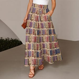 May include: A floor-length skirt featuring a repeating pattern of vintage-style books in shades of blue, red, and cream. The skirt has a high, elasticized waistband with a drawstring tie, a wide-leg silhouette, and side pockets for utility.