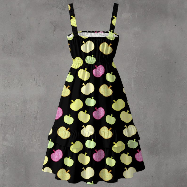 May include: Black sundress with a pattern of yellow, green, and pink apples. The dress has a fitted bodice, adjustable straps, and a tiered skirt. The dress is made of a lightweight fabric, perfect for warm weather.