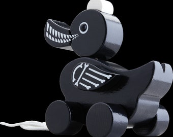 Design Pull toy black Duck. perfect present for babys and first birthday