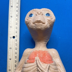 Talking E.T. Plastic, with Box, Pull string, working, by Universal Studios!  So cute.  The box was in bad shape so I removed him; E.T. is ok