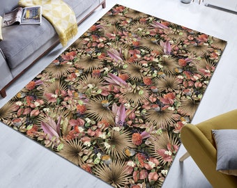 May include: A patterned rug with a floral design featuring brown palm leaves, pink flowers, and small birds. The rug has a dark background and a light brown colour scheme.