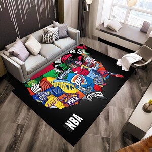 May include: A black and white rug with a map of the United States featuring logos of different NBA teams. The rug has the text "Reddit NBA" at the bottom.