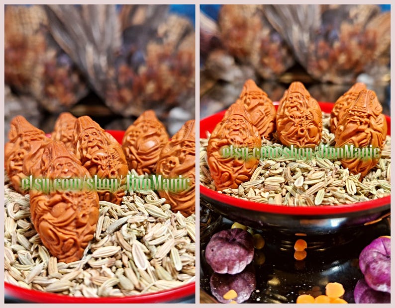 May include: A collection of reddish-brown, intricately carved figurines, possibly decorative items, displayed in a red bowl filled with seeds. The background is blurred, with hints of other objects. The figurines are the focal point.