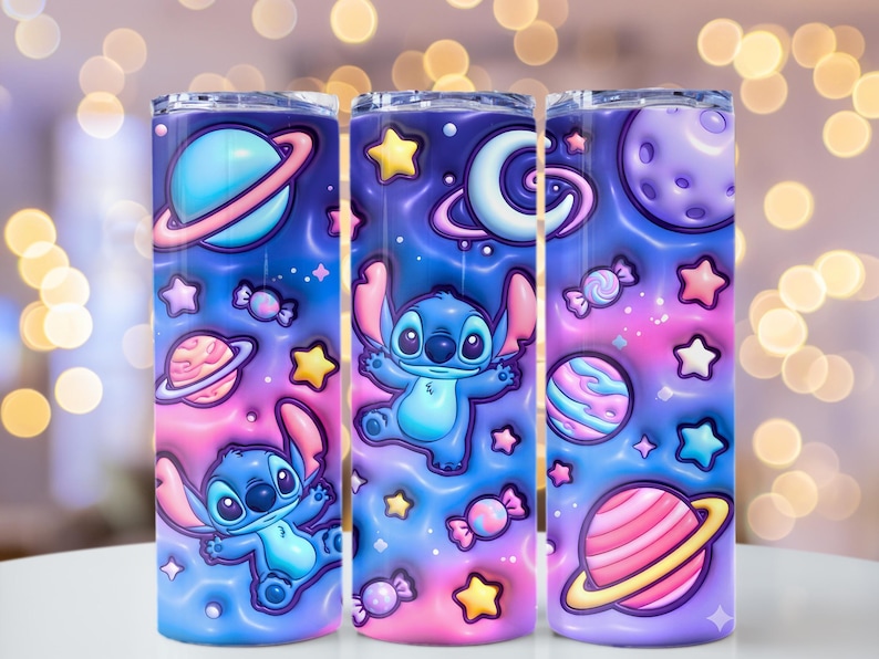 May include: Three stainless steel tumblers with a colorful space-themed design featuring the character Stitch. The design includes planets, stars, candy, and a blue and pink color scheme. The tumblers are cylindrical and appear to be approximately 8 inches tall.