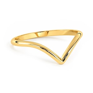 May include: A polished yellow gold ring featuring a V-shaped chevron design. The band has a smooth, rounded surface with a reflective metallic finish, forming a sharp point at the center of the ring's silhouette against a plain background.