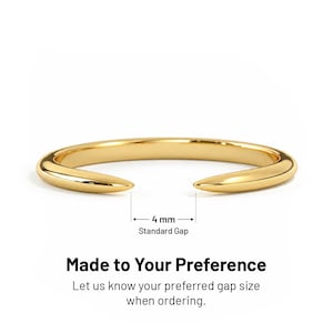 May include: A gold-colored open ring with tapered ends. The gap between the ends is labeled as 4 mm Standard Gap. Text below the ring reads: Made to Your Preference. Let us know your preferred gap size when ordering. The ring has a smooth finish.