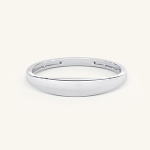 May include: A simple, silver band ring with a rounded, slightly domed top.