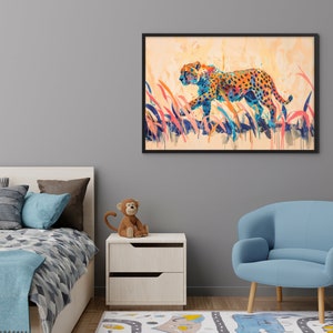 May include: A framed art print featuring a colorful cheetah walking through tall grass. The cheetah is depicted with orange, blue, and yellow spots. The artwork has a watercolor style and is set against a light orange background.