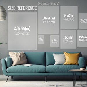 May include: A size reference chart for artwork, showing different sizes in inches and centimeters. The chart is displayed on a gray wall with a teal sofa and a coffee table in front of it.
