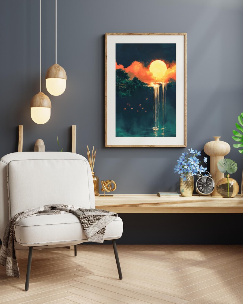 May include: A framed print of a digital painting depicting a waterfall cascading from a cliff with a large orange sun setting behind it. The scene is set in a lush green forest with a dark blue sky.