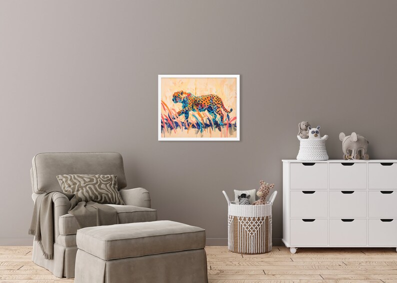 May include: A framed watercolor painting of a cheetah in a field of tall grass. The cheetah is depicted with orange spots and blue and yellow accents. The artwork is set against a beige background.
