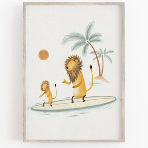 May include: A framed art print featuring two cartoon lions surfing on a surfboard in the ocean. The artwork has a light color palette with palm trees, a sun, and a light blue ocean. The lions are yellow with brown manes.