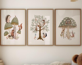 May include: Three framed art prints with woodland animal illustrations. The prints feature a hedgehog, squirrel, and raccoon interacting with mushrooms and trees. The artwork is in a child's bedroom with a wooden floor, a daybed, and a teddy bear.